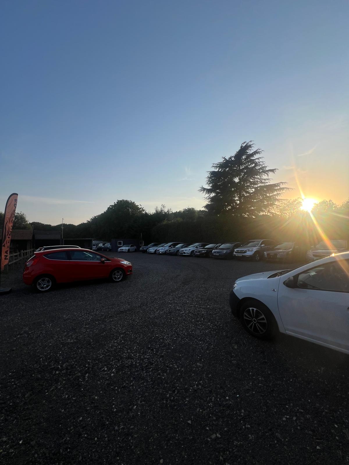 Vehicle yard space at sunset